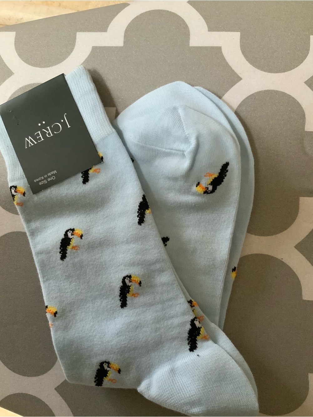 J.Crew toucan-print socks feature a light blue base